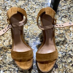 Gianvito Rossi. Beautifully crafted, they carry straps made of brown suede